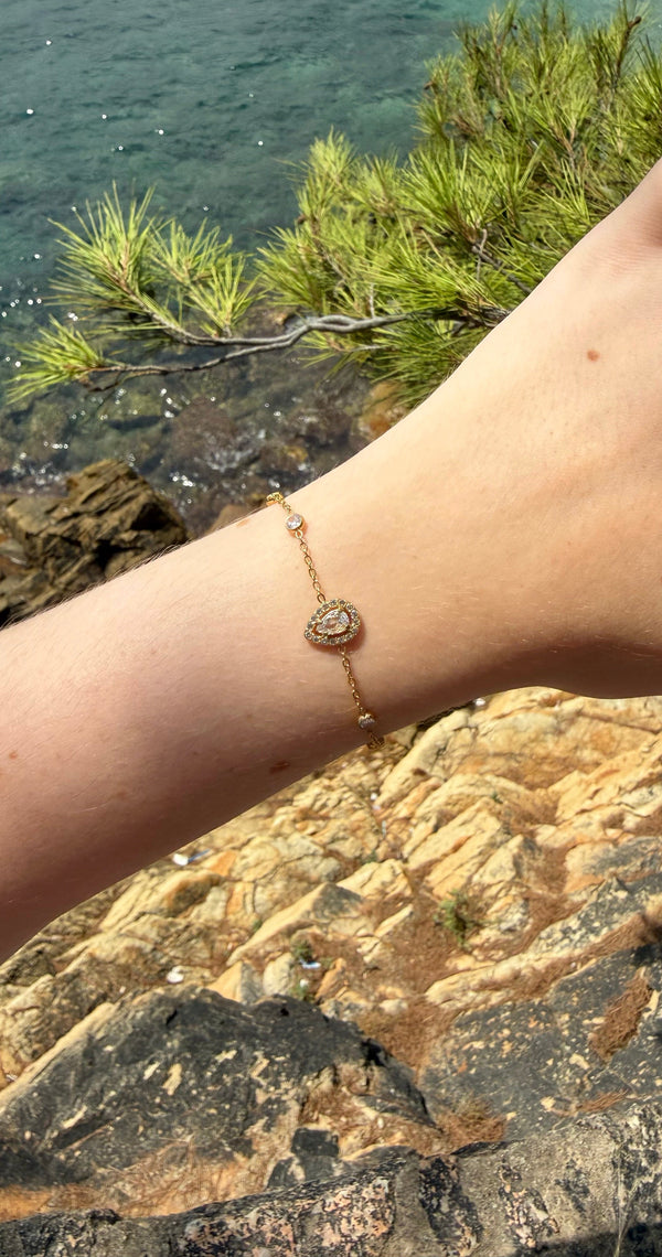 Bracelet Spark, doré, en acier inoxydable, orné d’un pendentif ovale scintillant et de petits strass délicats 